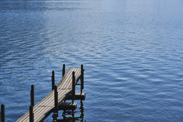 view of the wooden pier in the lake 