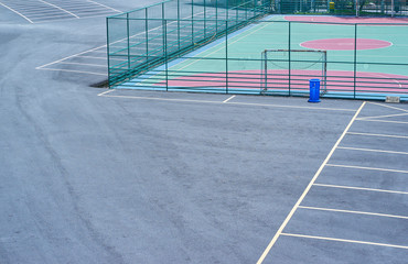 Asphalt parking floor with soccer playground .