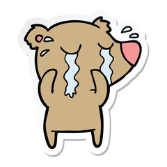 sticker of a cartoon crying bear