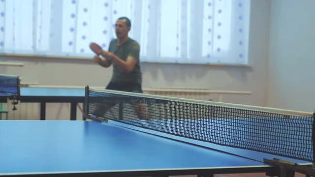 table tennis forehand lifestyle concept. blurred focus man playing training table tennis the sport active
