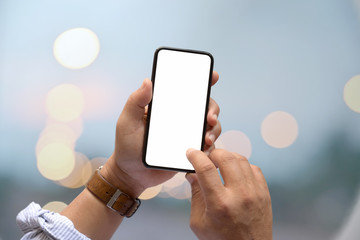 Male hand and blank screen mobile phone