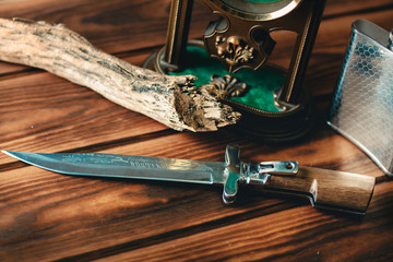 Haunting knife on wooden table