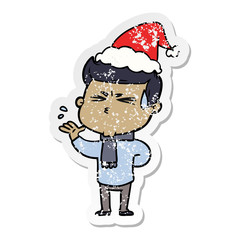distressed sticker cartoon of a man sweating wearing santa hat