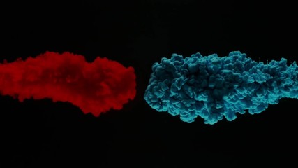 Super slowmotion shot of color inks in water. Shot with high speed camera at 4K.