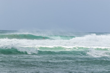 man surfer catching into tube barrel wave from Kirra beach Coolangatta Queensland Gold Coast Australia 