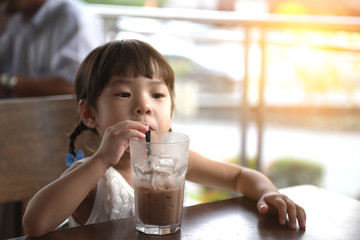 asian children girl at outdoor cafe