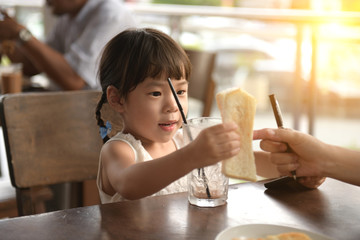asian children girl at outdoor cafe