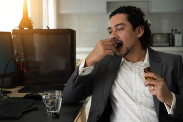 sick looking indian business male at office