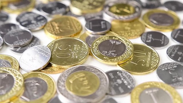Saudi Riyal Coins Rotating. Saudi Arabia currency. Slow motion.