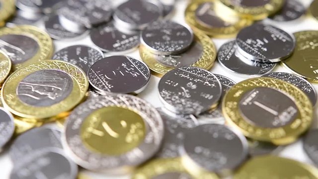 Saudi Riyal Coins Rotating. Saudi Arabia currency. Slow motion.