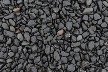 Black pebble stone background texture
