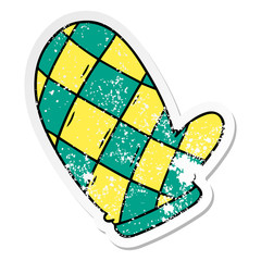 distressed sticker cartoon doodle of an oven glove