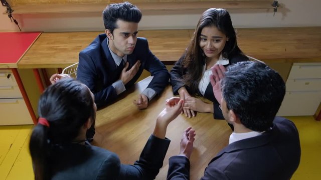 Static shot of coworkers colleagues apologies, regret and seek forgiveness from each other with serious face for the failures and lack of responsibilities but end up in blaming and heated discussion 