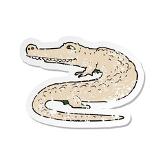 retro distressed sticker of a cartoon alligator