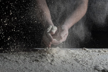 Man prepares a meal of flour
