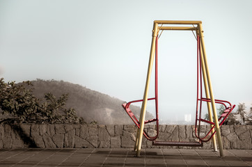 Lonely Chairs at the city with a mountain background
