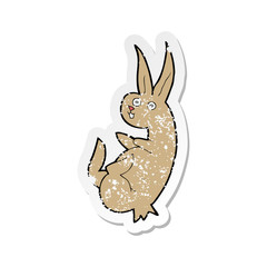 retro distressed sticker of a cue cartoon rabbit