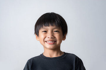 portrait of cute boy smiling, asian boy on white background - Powered by Adobe