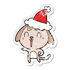 cute distressed sticker cartoon of a dog wearing santa hat