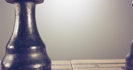 Special tracking macro shot moving between chess pieces on a chess board