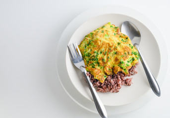 rice with vegetables and omelet top view