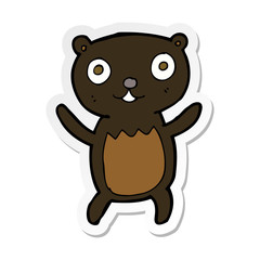 sticker of a cartoon black bear cub