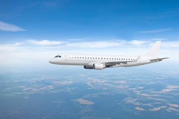 Passenger airplane flies in the sky, performing flight.