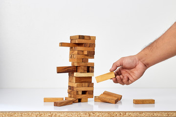 Businessman playing with the wood game