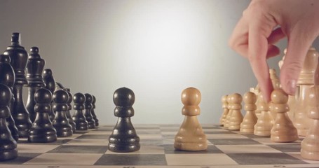 Special tracking macro shot moving between chess pieces on a chess board