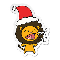sticker cartoon of a roaring lion wearing santa hat