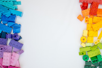 Multicolor Bricks cubes on white background. Popular toys.