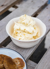 Homemade banana vanilla ice cream with pancakes on wooden table for breakfast.