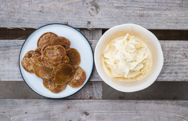 Homemade banana vanilla ice cream with pancakes on wooden table for breakfast.