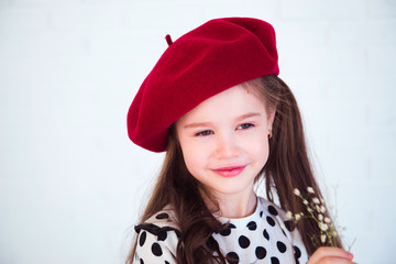 cute girl slylish polka dot dress and red hat