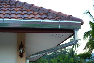 pipe stainless steel of roof gutter on residential house