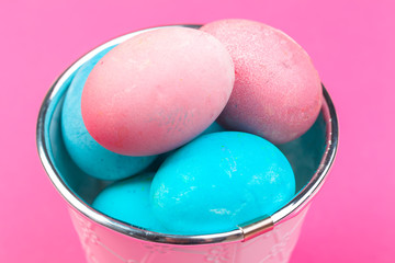 Colorful easter painted eggs on pink background