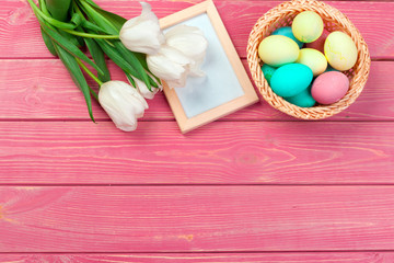 Easter background with tulips, eggs . Top view with copy space