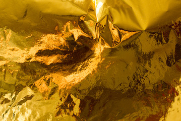 Holographic real gold texture in trendy colors with scratches and irregularities. Holographic color...