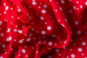 Polka dot on red canvas cotton texture, fabric background