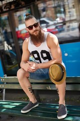 Street portrait of young bearded man