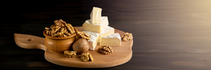 Cheese camembert or brie with walnut kernels