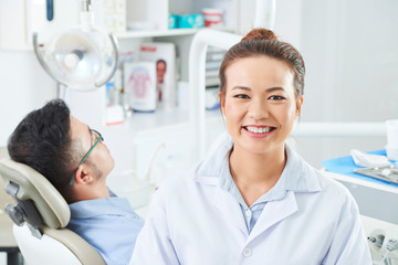 Female nurse working in dental clinic