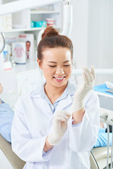 Female doctor preparing for work