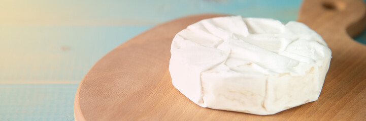 Cheese camembert or brie with walnut kernels
