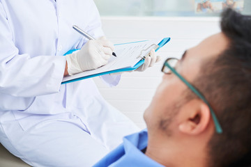 Doctor prescribing treatment