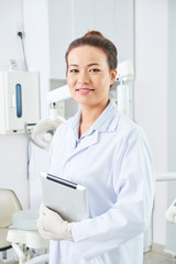 Young dentist in dental clinic