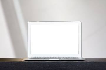 Mock up of modern computer or laptop with over blur festive bokeh background.