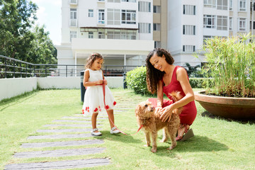 Family walking with the dog