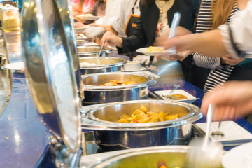 Close up hand of people take buffet food lunch meal