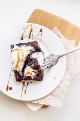 Classic chocolate dessert with a cup of coffee - brownies and ice cream